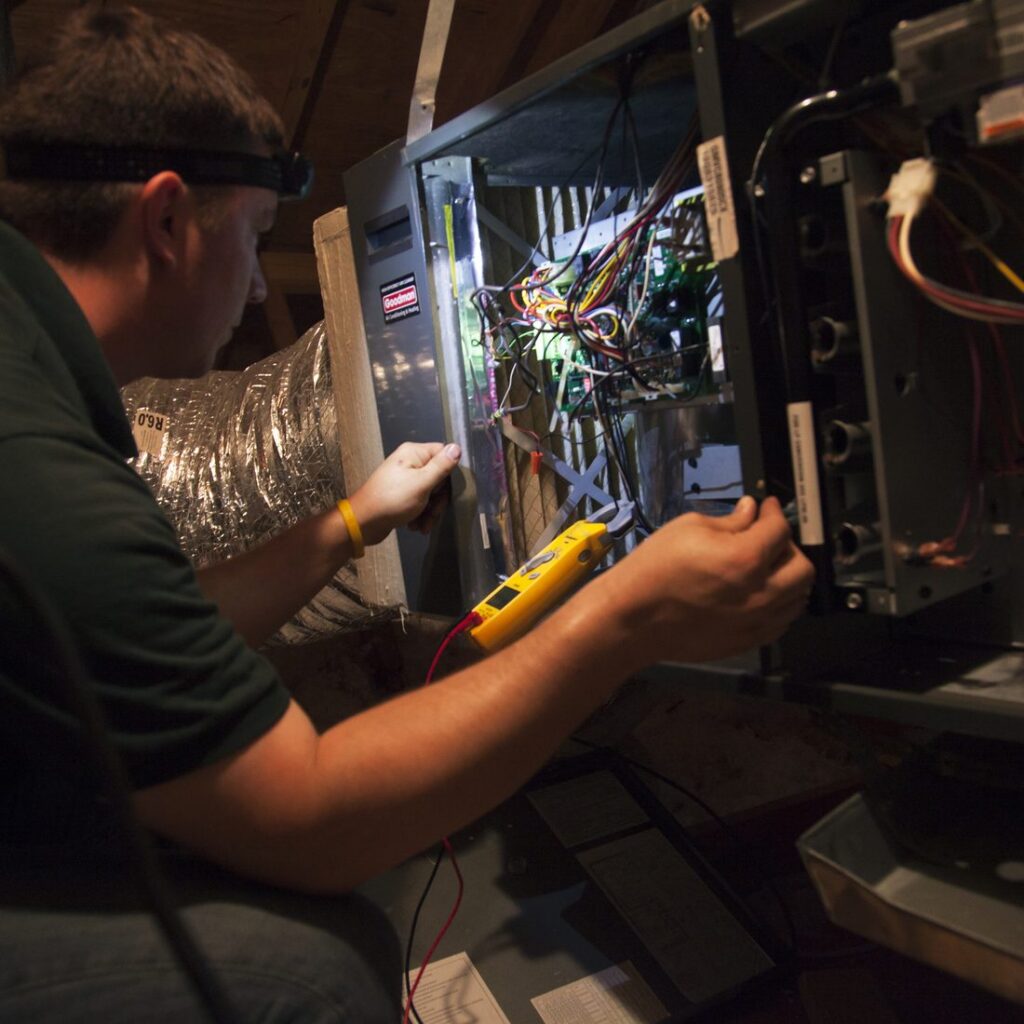 AC Genius HVAC technician servicing an air conditioner at a Flower Mound, TX home